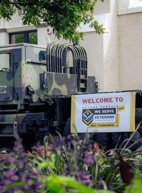 Military vehicle with Hire Heros banner