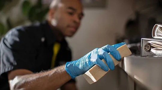 ServiceMaster Restore employee cleaning shelf