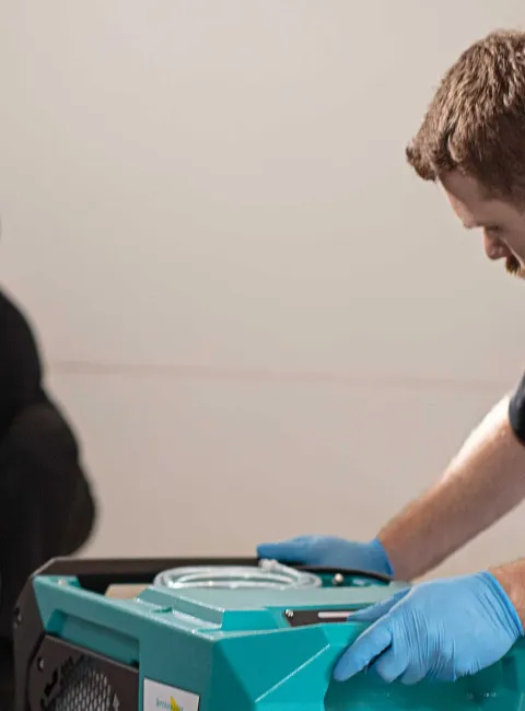 ServiceMaster Restore employees drying water